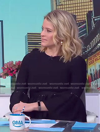 Sara's navy bell sleeve peplum top on GMA Day