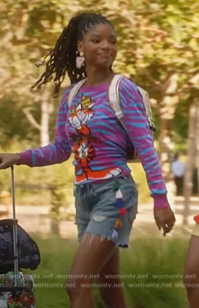 Skylar's pink tiger graphic sweatshirt and tassel side denim shorts on Grown-ish