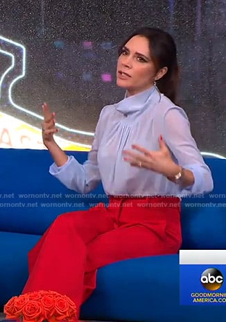 Victoria Beckham's blue sheer top and red pants on Good Morning America