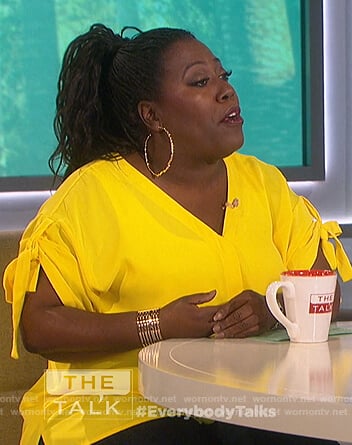 Sheryl's yellow tie sleeve top on The Talk