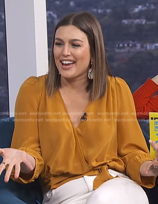Carissa's orange wrap top on E! News Daily Pop