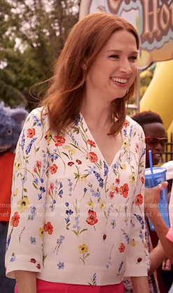 Kimmy's white floral v-neck top on Unbreakable Kimmy Schmidt
