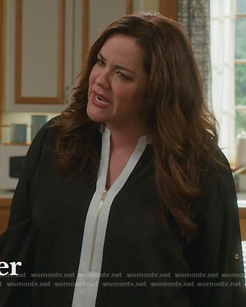 Katie's black contrast zip up blouse on American Housewife