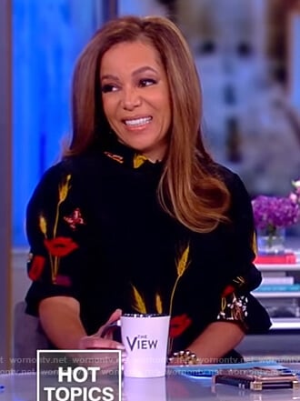 Sunny's black floral high neck blouse on The View