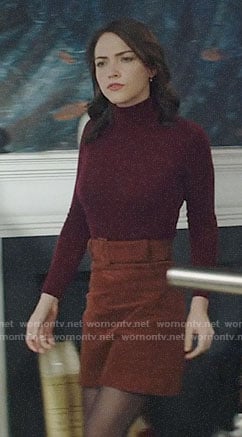 Cara's burgundy turtleneck and tan skirt on God Friended Me