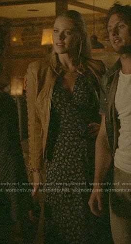 Isobel's navy floral wrap dress and leather jacket with lace-up sleeves on Roswell New Mexico