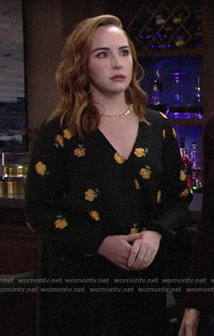 Mariah's black and orange floral blouse on The Young and the Restless