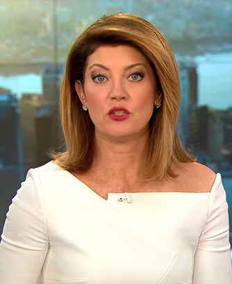 Norah's white asymmetric top on CBS This Morning