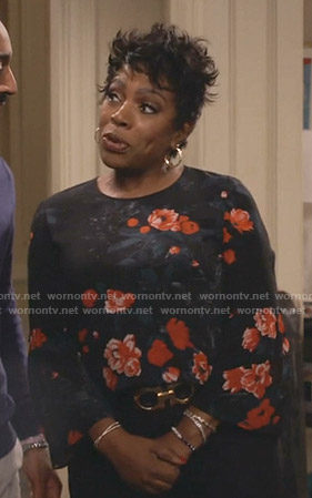 Rose's black floral bell sleeve top on Fam