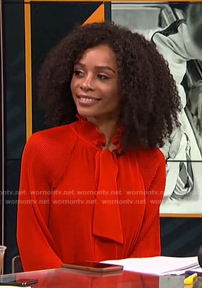 Zuri's red pleated tie neck blouse on Live from E!