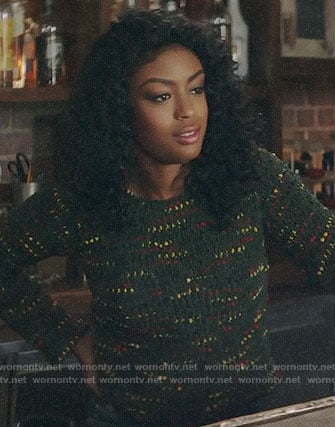 Ali's green speckled sweater and grommet trim jeans on God Friended Me