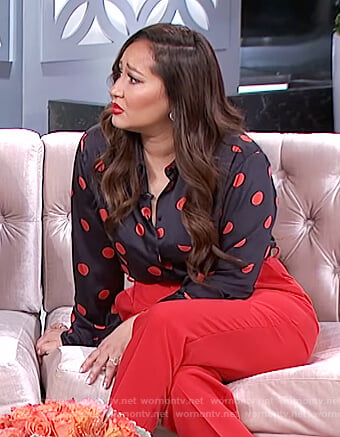 Adrienne's navy polka dot shirt on The Real