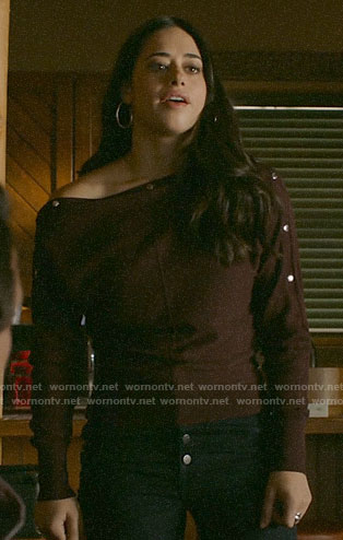 Liz's burgundy sweater with buttoned sleeves on Roswell New Mexico