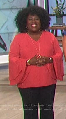 Sheryl's pink tiered bell sleeve top on The Talk