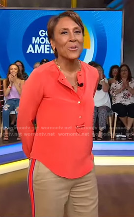 Robin's orange blouse and side striped pants on Good Morning America
