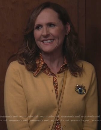 Val's yellow eye embroidered cardigan on Will and Grace