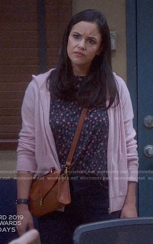 Amy's floral tee and pink hoodie on Brooklyn Nine-Nine
