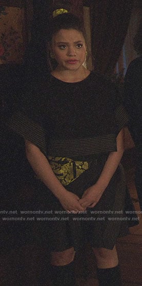 Maggie's black boxy crop to and skirt and snake print belt bag on Charmed