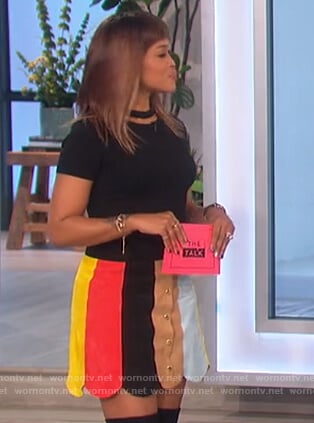 Eve's black cutout top and scalloped skirt on The Talk