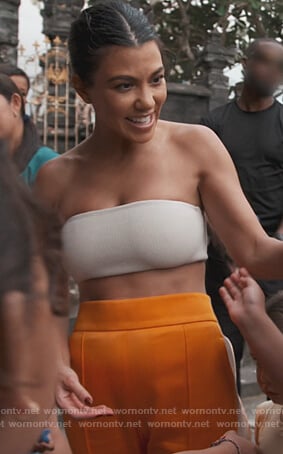 Kourtney's white tube top and orange stripe pants on Keeping Up with the Kardashians