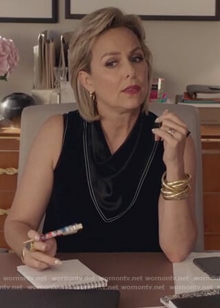 Jacqueline's black mock neck satin blouse on The Bold Type