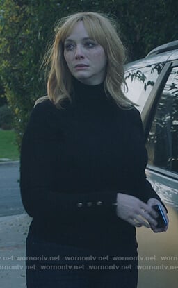 Beth's black turtleneck top with button cuffs on Good Girls