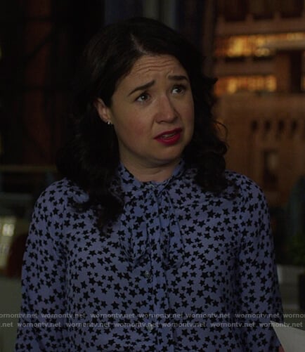 Marissa's blue star print tie neck blouse on The Good Fight