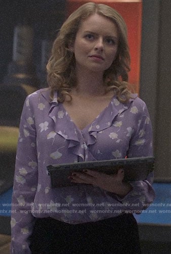 Eve's purple floral wrap blouse on Supergirl