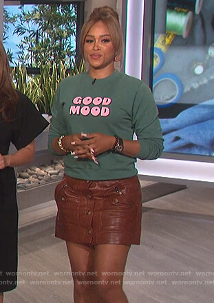 Eve's green Good Mood sweater on The Talk