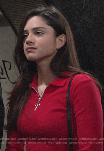 Lola's red zip neck polo top on The Young and the Restless