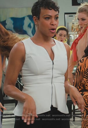 Angela's white zip down top on American Housewife