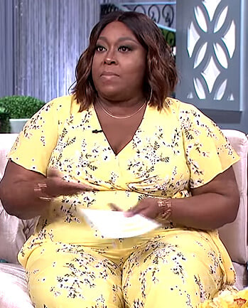 Loni's yellow floral print jumpsuit on The Real
