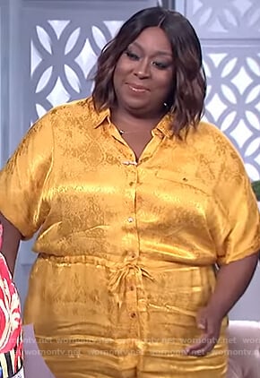 Loni's yellow metallic print jumpsuit on The Real