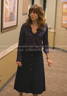 Judy's navy heart print blouse and denim skirt on Dead to Me