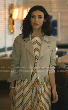 Alicia's white and orange striped dress and beige jacket on Grand Hotel