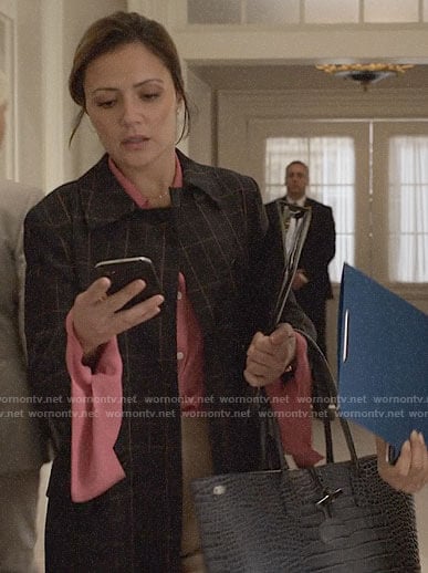 Emily's checked coat and leather tote bag on Designated Survivor