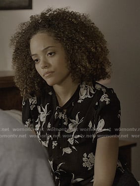 Tabitha's black floral tie neck top on Trinkets