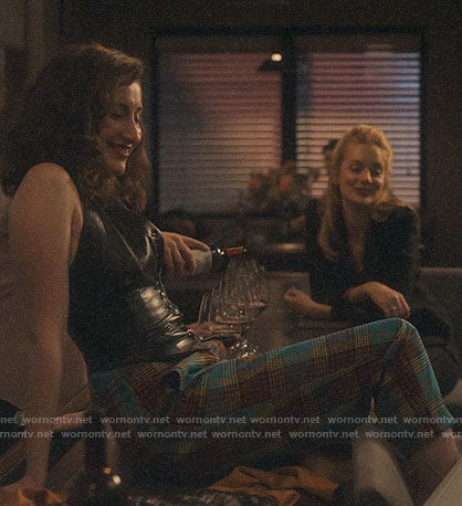 Ari's blue plaid pants and leather waistcoat top on Sweetbitter