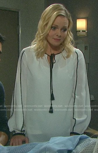 Belle's white blouse with black trim on Days of our Lives