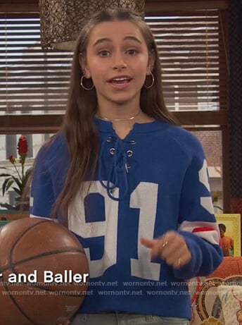 Tess's blue lace-up sweater on Ravens Home