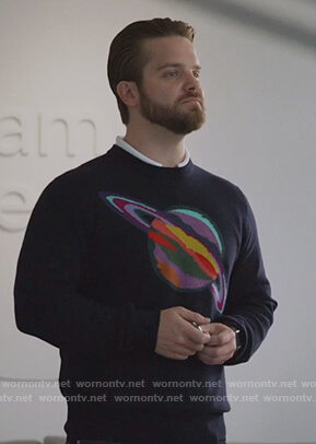 Evan's blue planet print sweater on Good Trouble