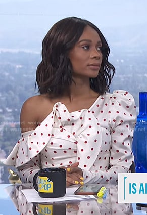 Zuri's white polka dot asymmetric top on E! News Daily Pop