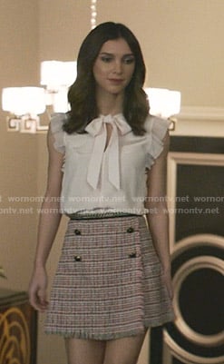 Alicia's pink tie neck top and tweed skirt on Grand Hotel