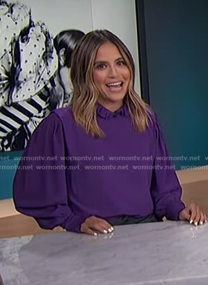 Erin's purple ruffled blouse on E! News