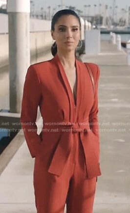 Gigi's orange v-neck jumpsuit on Grand Hotel