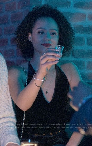 Maya's black velvet strappy back jumpsuit on Four Weddings and a Funeral