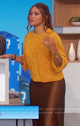 Eve's yellow sweater and satin skirt on The Talk
