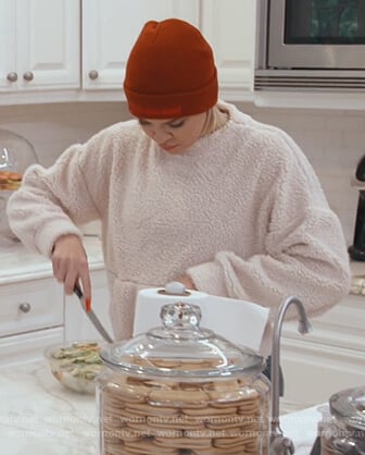 Khloe's white fur sweater on Keeping Up with the Kardashians