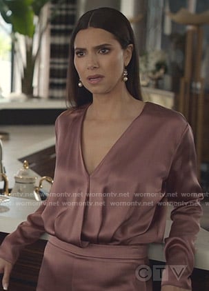 Gigi's pink wrap top and slit pants on Grand Hotel