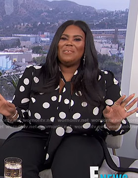 Nina's black polka dot tie neck top on E! News